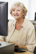 Senior woman learning to use computer